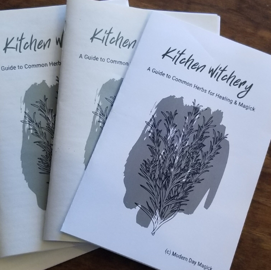 stack of three paper pamphlets titled "Kitchen Witchery: a guide to common herbs for healing and magick"